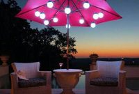 Patio Umbrella Marquee Lights White Wicker Chair Scene At Night pertaining to size 936 X 936