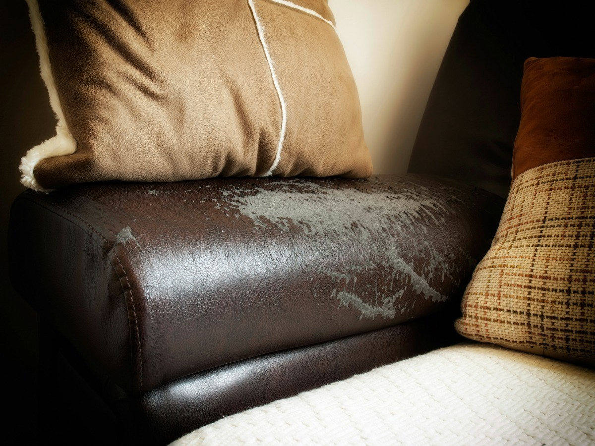white spots on brown leather sofa
